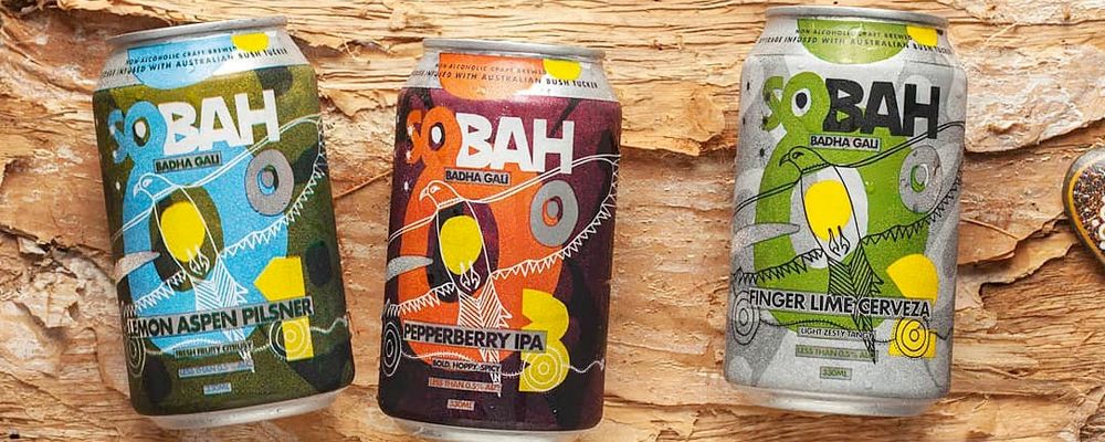 Three Sobah cans featuring First Nations artwork.